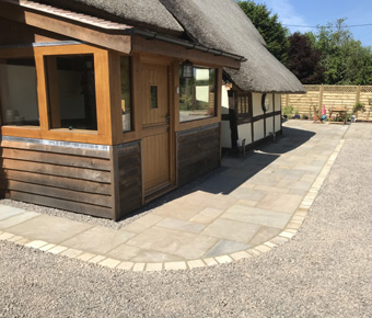 King Landscapes Gloucester Stone and Brickwork photo of driveway round house