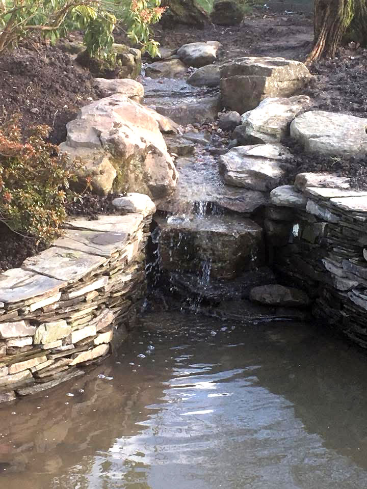 King Landscapes photo cascade into walled pond