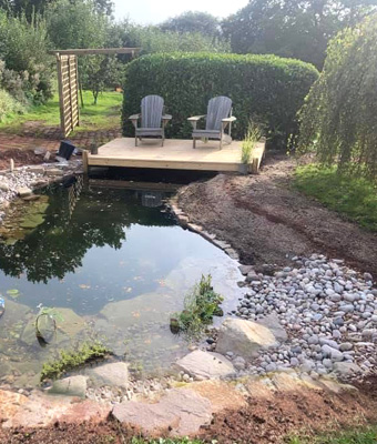 King Landscapes photo of pond with seating area