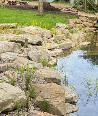 King landscapes photo of large rocks next to pond