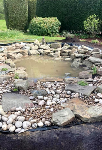 King Landscapes photo of rocks around pond